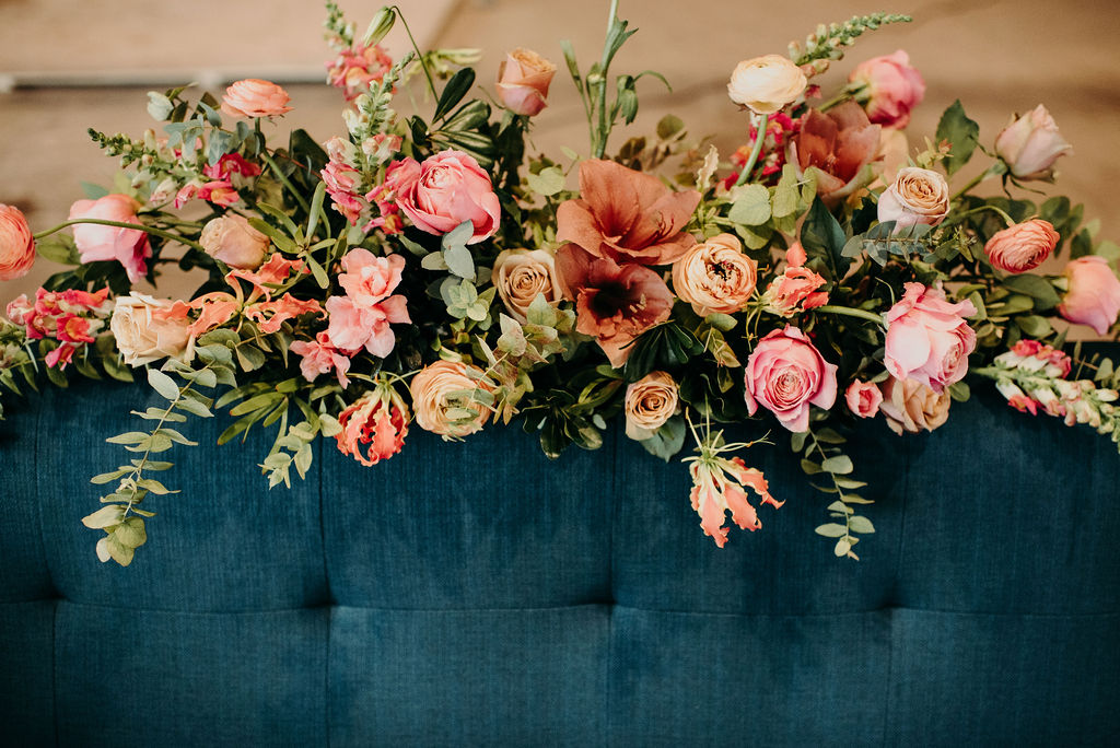 flowers on a blue couch