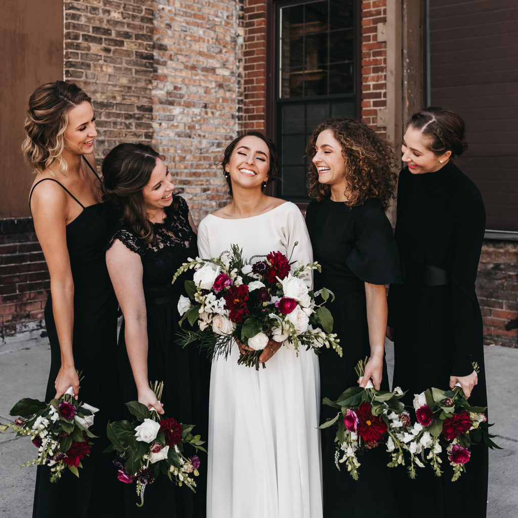 black bridesmaid dresses with burgundy and white flowers