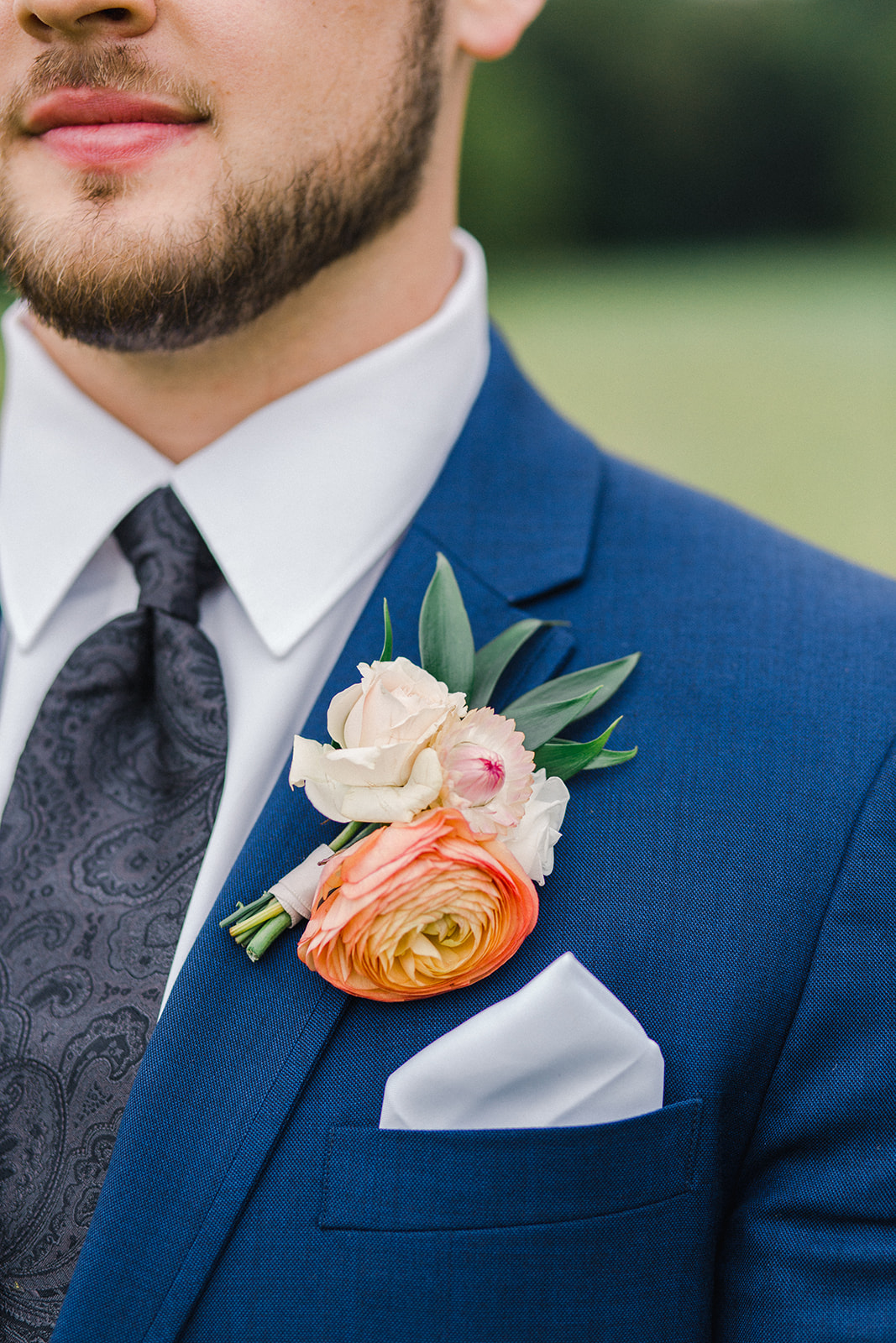 colorful boutonniere by Minnesota and Wisconsin wedding florist Studio Fleurette for a barn wedding.