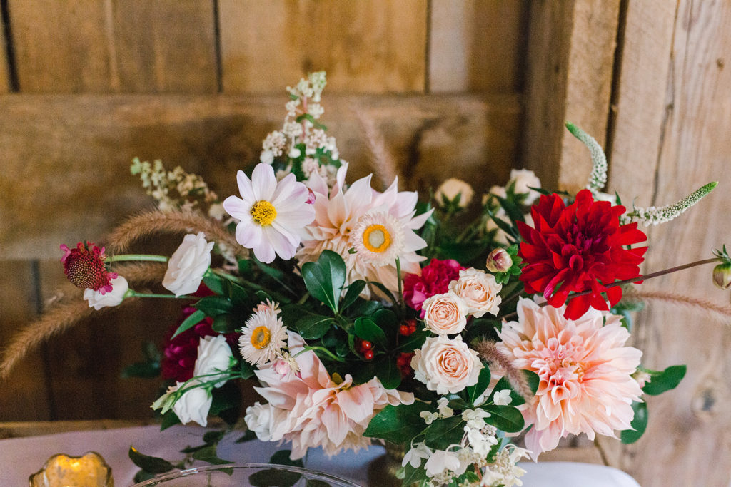 dahlia and rose centerpiece with WI local flowers by Studio Fleurette at a barn wedding.
