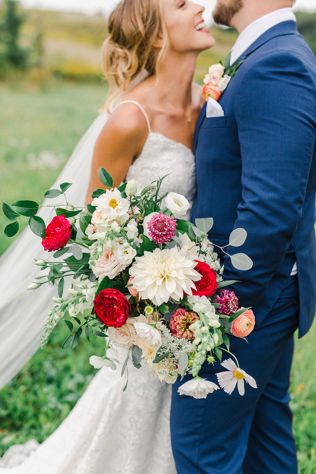 colorful bohemian bridal bouquet with local flowers by Studio Fleurette at a rustic barn in Wisconsin.