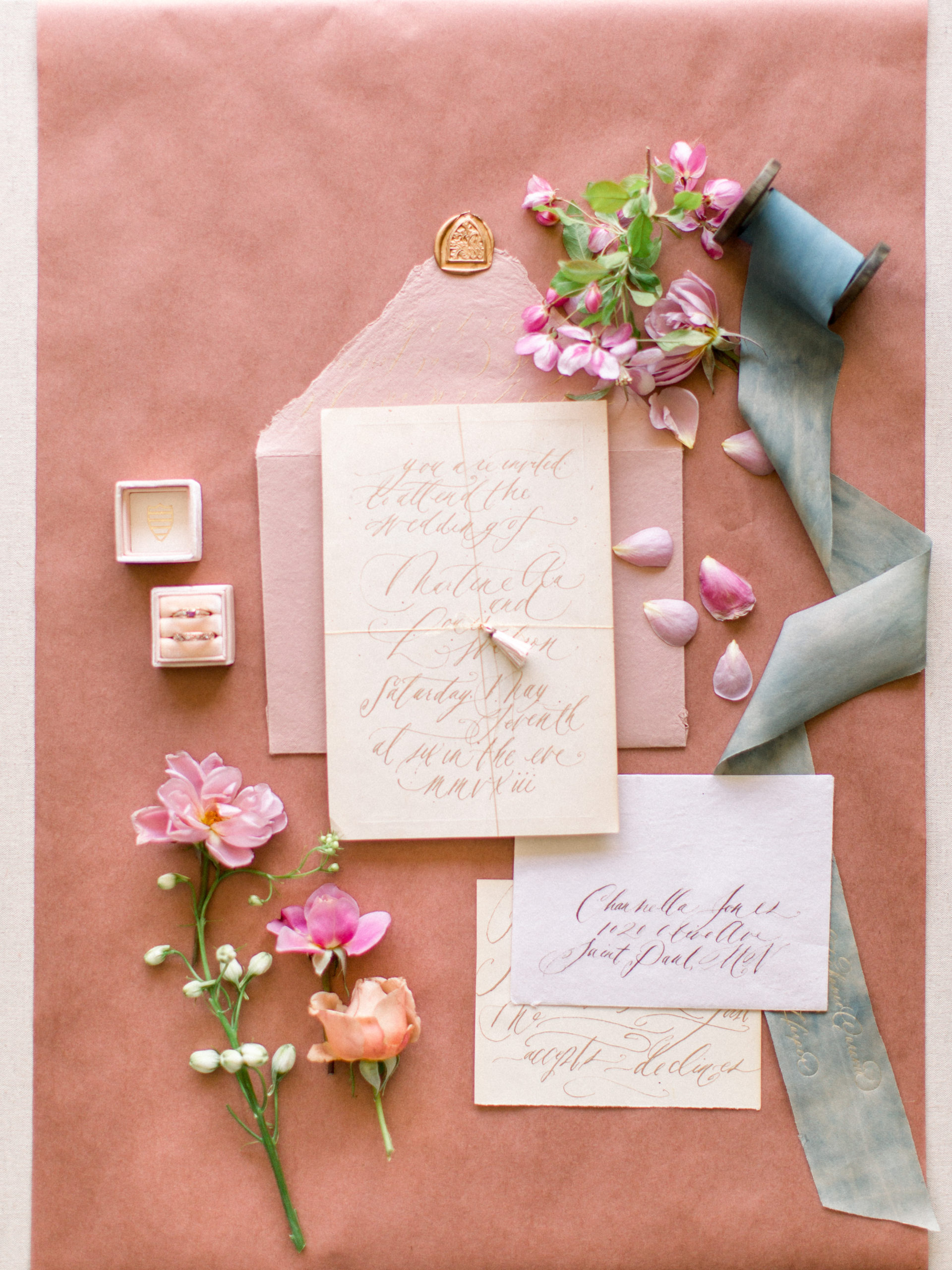 romantic paper flatlay styling with flowers and silk ribbon.