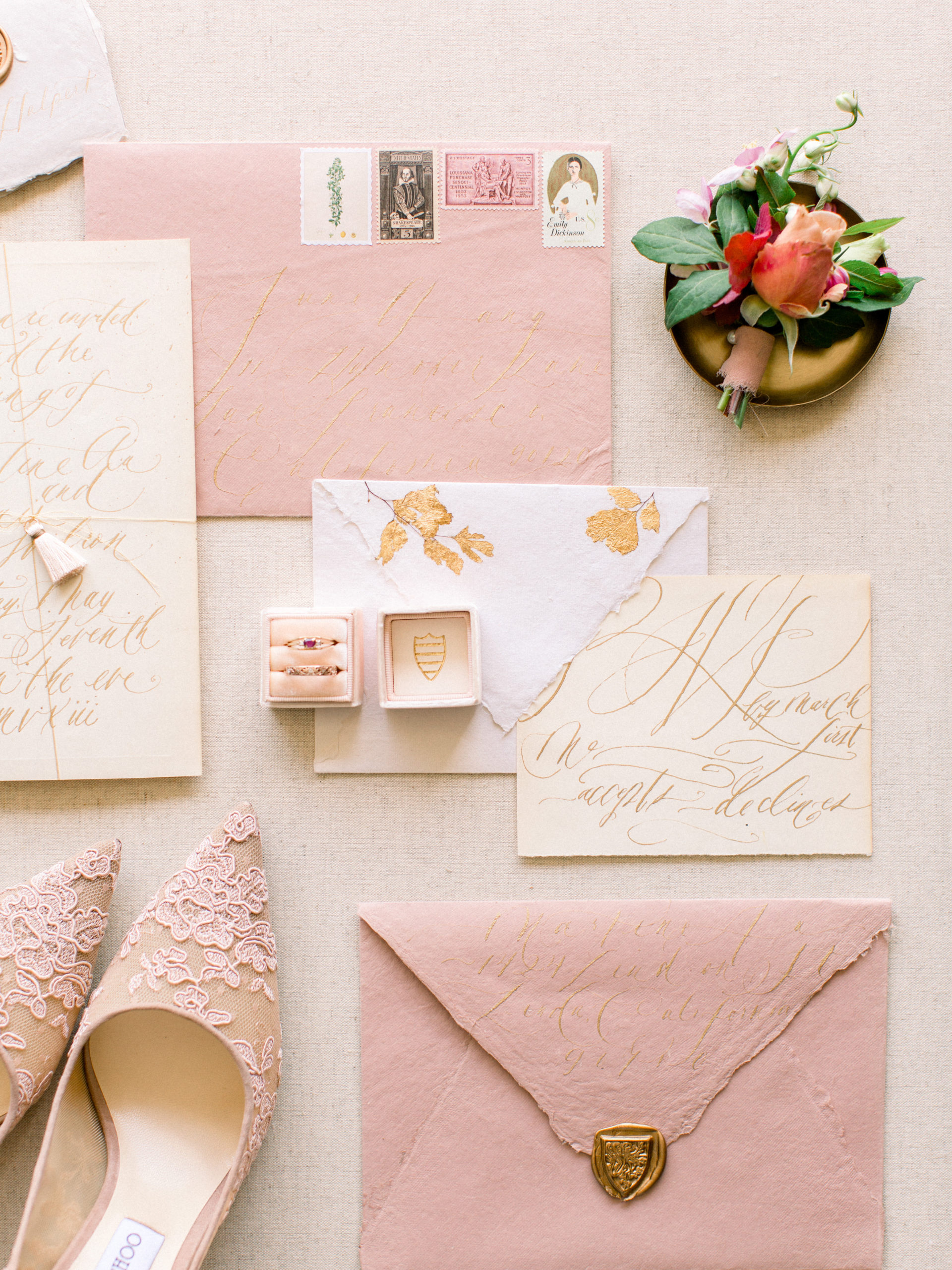 styled rose gold wedding invitation suite with calligraphy by Shasta Bell and boutonniere by Studio Fleurette.