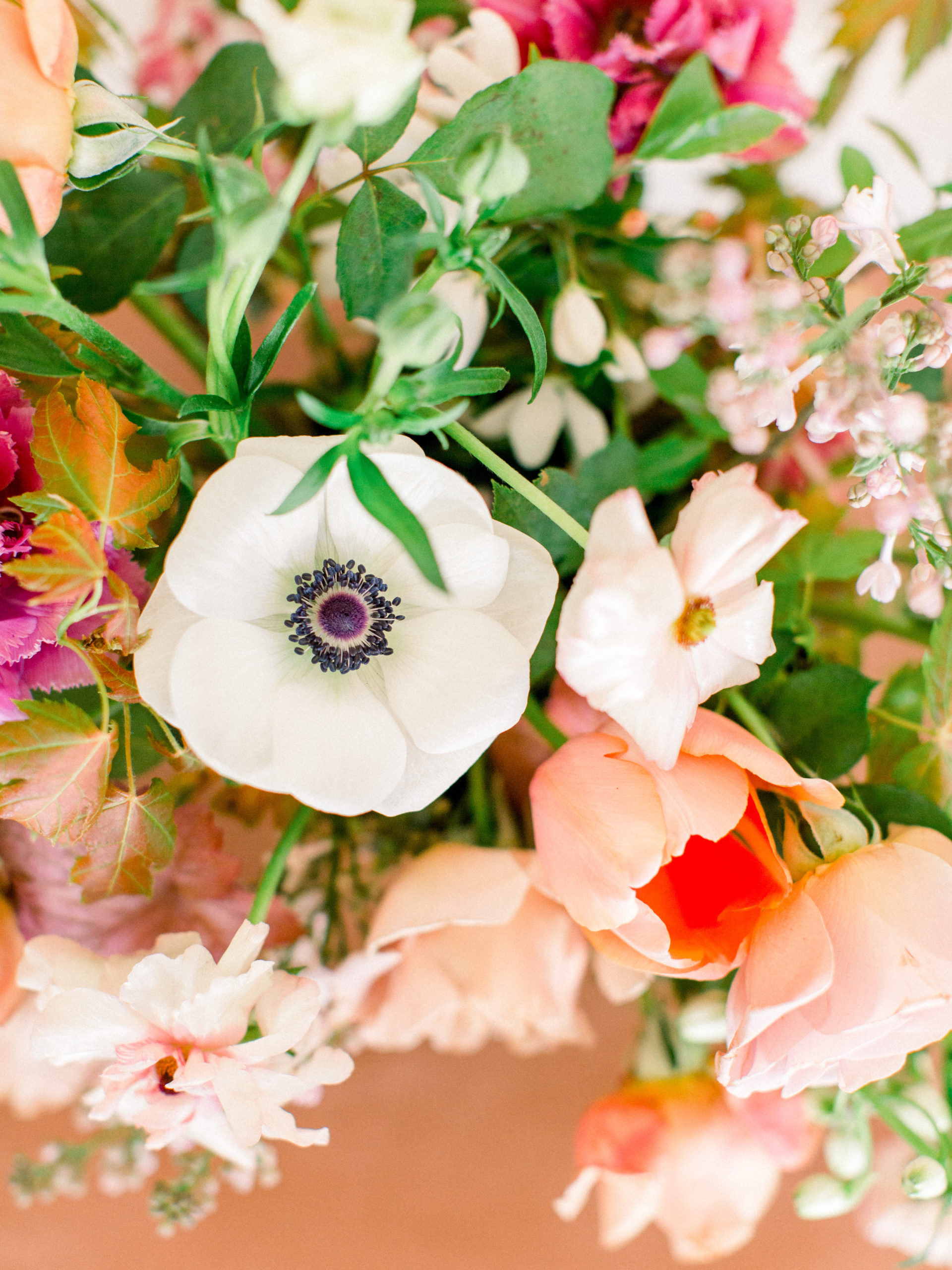 Colorful rust, orange and pink wedding flowers for a spring wedding in Minnesota by Studio Fleurette.