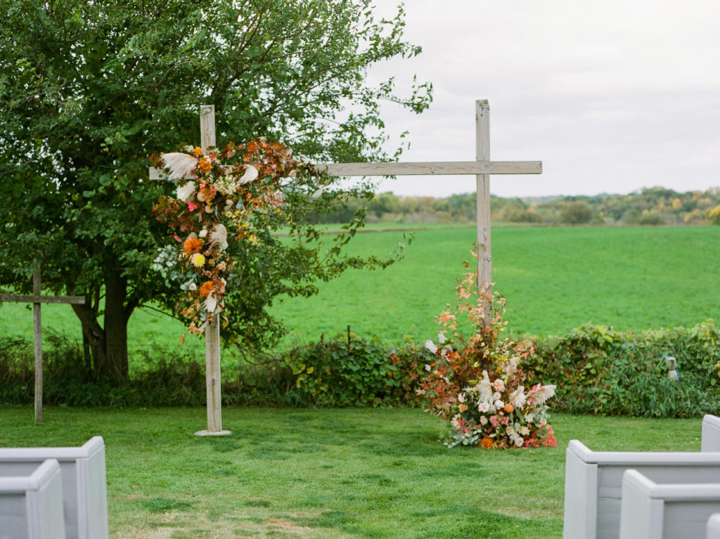 Asymmetrical pampas grass fall wedding arch at Legacy Hill Farm. Flowers by Studio Fleurette.