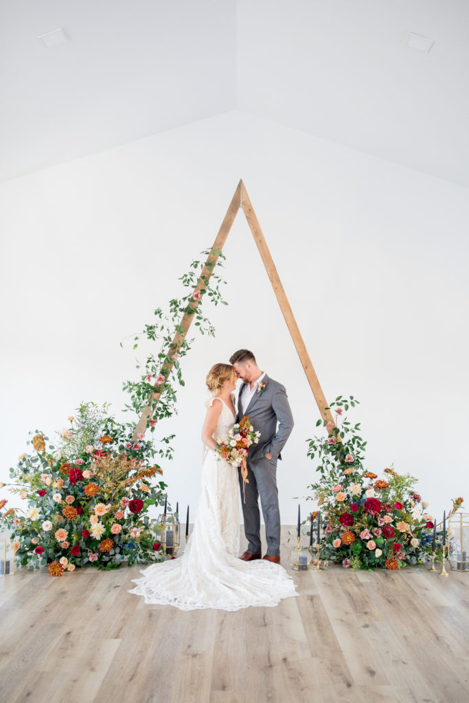 colorful triangle wedding arch at Pinewood in Cambridge Minnesota.
